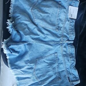 Light Blue Denim Mini Skirt with Frayed Hem